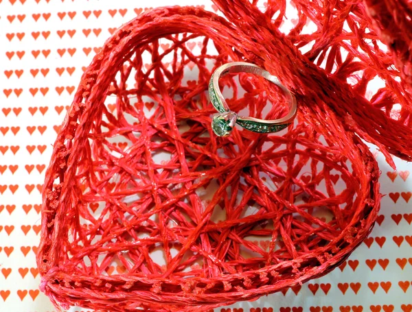 Heart-shaped container and a big diamond ring — Stock Photo, Image