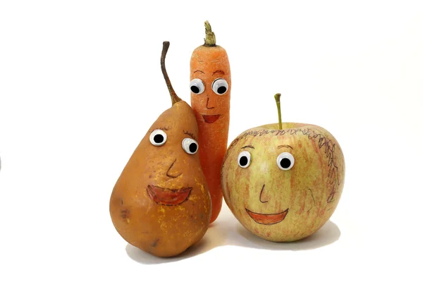 PEAR and carrot and one apple with eyes — Stock Photo, Image