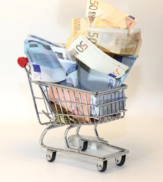 Shopping cart full of crumpled euro money — Stock Photo, Image