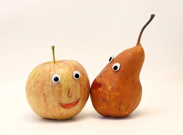 Pair of fruits apple and PEAR with eyes — Stock Photo, Image