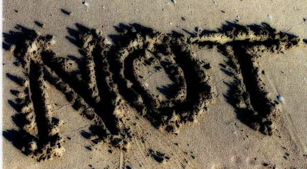 NON sulla sabbia della spiaggia del mare — Foto Stock