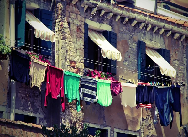 Drying laundry outdoors to dry on window sill — Stock Photo, Image