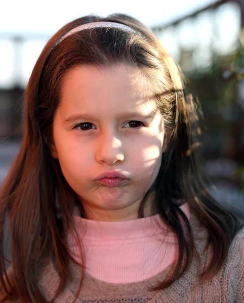 European child angry with a wool sweater — Stock Photo, Image