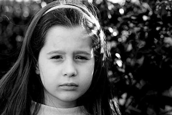 Portrait of a little girl very serious — Stock Photo, Image