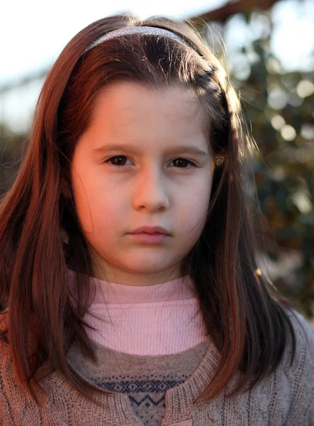 Pretty little girl with very serious with wool sweater — Stock Photo, Image