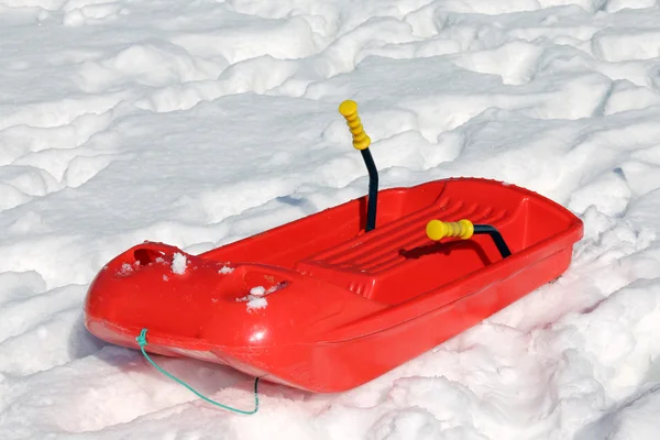 Red bob in the snow in the mountains — Stock Photo, Image