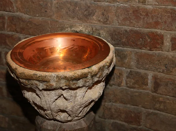 Stoup inside the Church in a copper vase — Stock Photo, Image