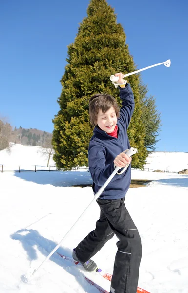 Young boy  falls with cross-country skis — Stock Photo, Image