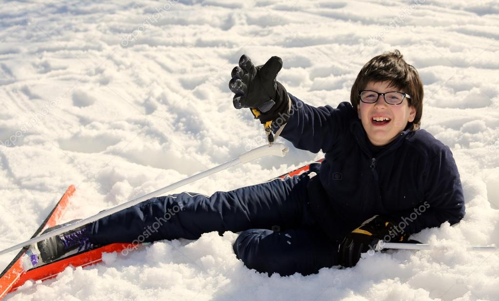 boy asks for help after the fall on skis