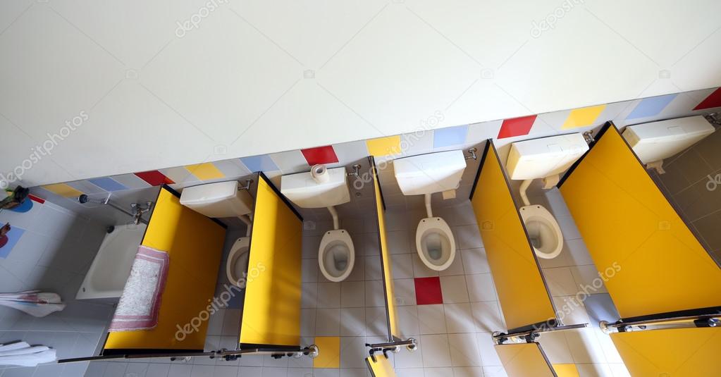 Bathroom of the nursery from above with water closet very small 