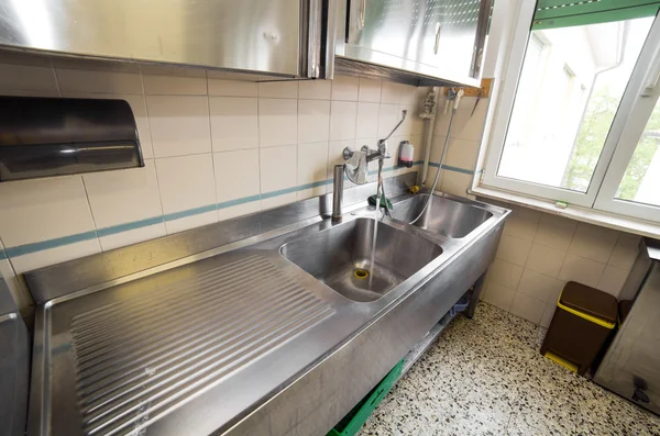 Huge sink stainless steel industrial kitchen with tap — Stock Photo, Image