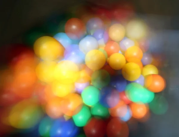 As in a dream, out of colored balls inside the big bag — Stock Photo, Image