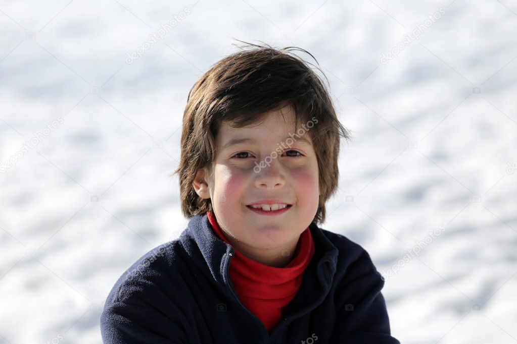 Portrait of a cute young boy in the mountains