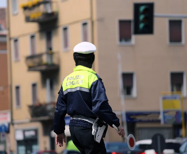 Italian policeman in uniform while blocking traffic with the Red — Stock Photo, Image