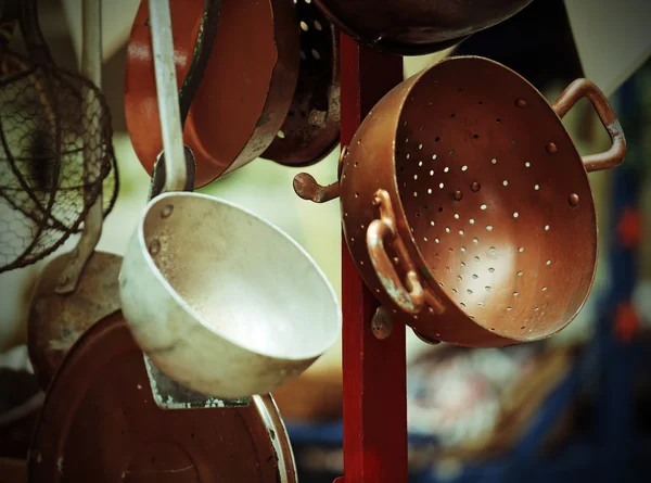 Copper colander in cart for sale at flea market — Stock Photo, Image