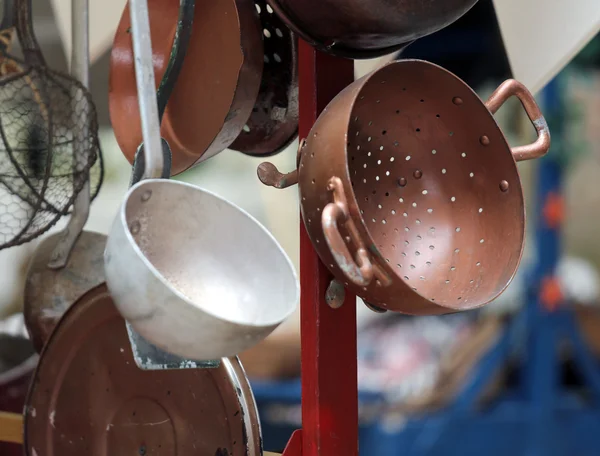 Ancient copper colander in cart for sale at flea market — Stock Photo, Image