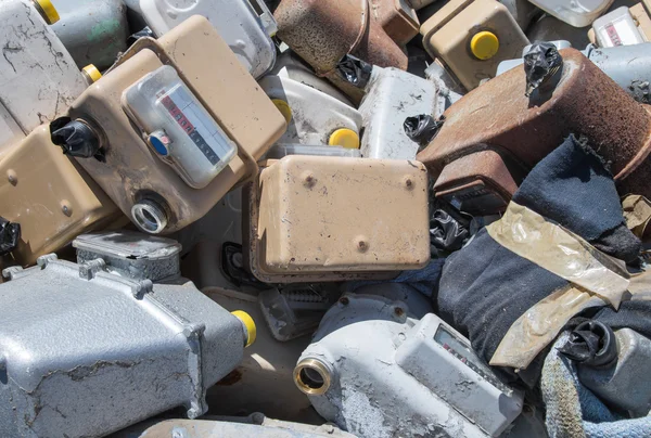 Old abandoned gas counters in waste landfill — Stock Photo, Image