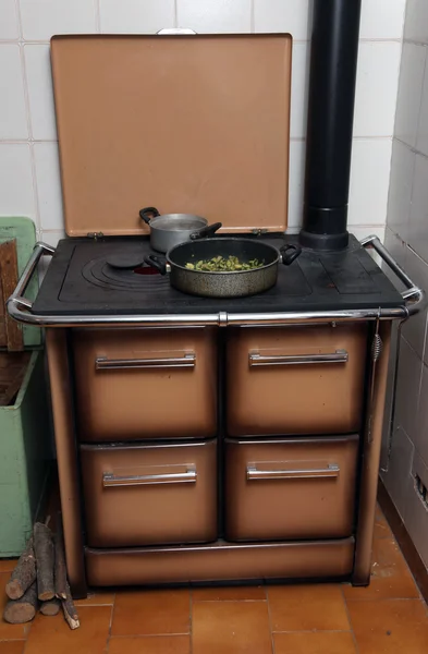 Green marrows with pot over the stove — Stock Photo, Image