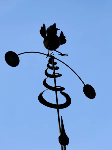 wind vane in the shape of a bird