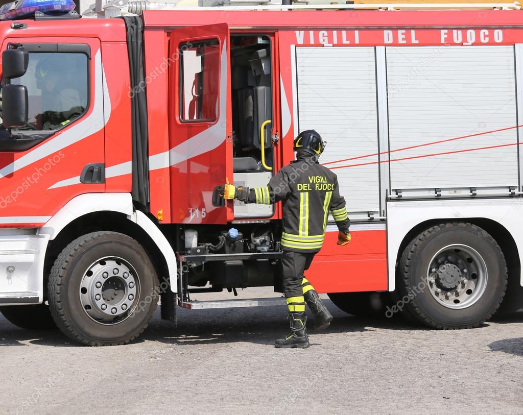 italian firefighters during an emergency with protective suits a