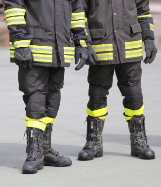 uniform boots of firefighters inthe firehouse clipart