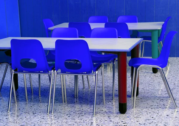 Classroom of a kindergarten with blue chairs — Stock Photo, Image