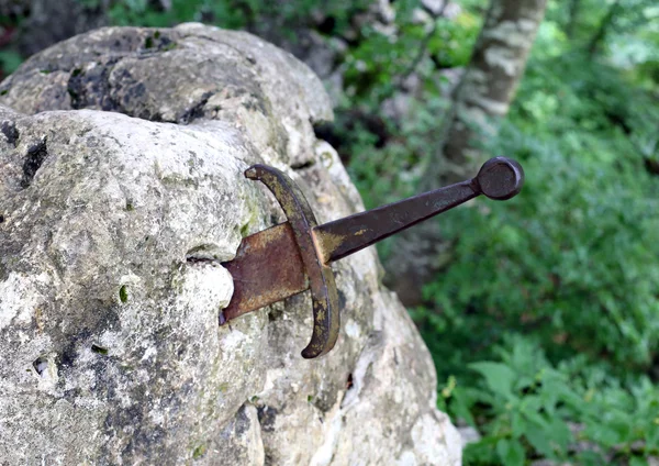 Excalibur the famous sword in the stone of king Arthur in the fo — Stock Photo, Image