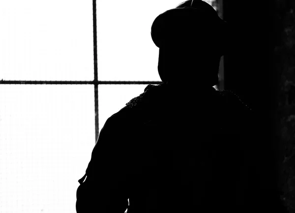 Silhouette of soldier with medieval helmet — Stock Photo, Image