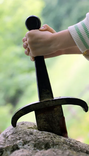 Excalibur the famous sword in the stone of king Arthur in the fo — Stock Photo, Image