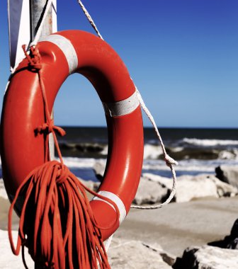 safety lifebuoy with rope to rescue swimmers clipart