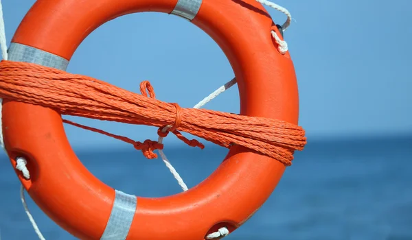 Orange jackets with rope to rescue swimmers — Stock Photo, Image