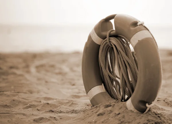 Orange jackets with rope to rescue swimmers in the sea — Stock Photo, Image