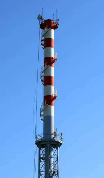 Highest red and white smokestack with  the antennas — Stock Photo, Image