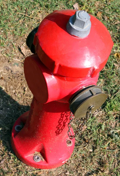 Red fire hydrant to extinguish fires in the village — Stock Photo, Image