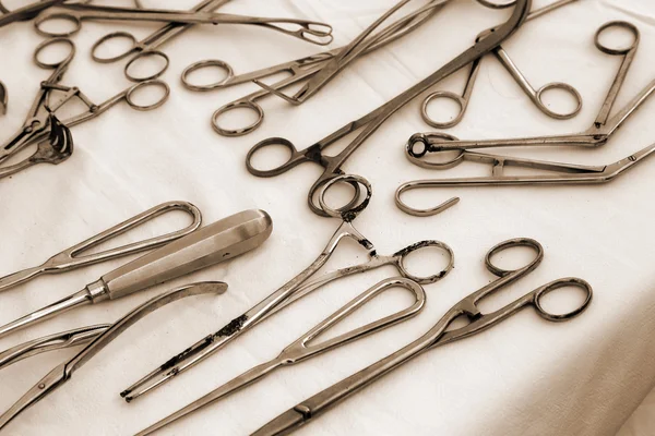 Forceps scissors and other ancient medical instruments — Stock Photo, Image