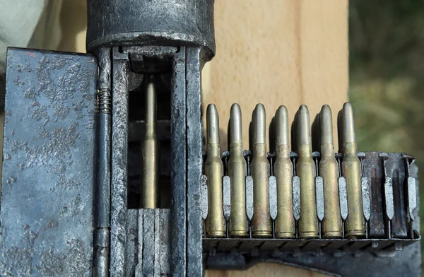 Army machine gun with bullets during war exercises — Stock Photo, Image