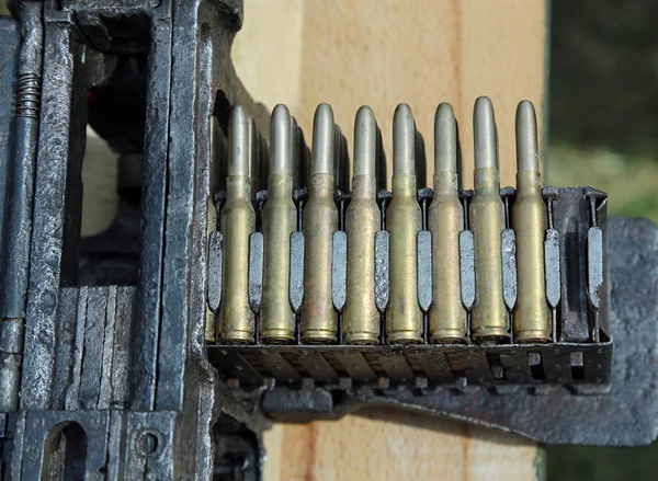 Machine gun with ammunition during war exercises — Stock Photo, Image