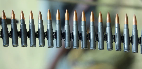 Machine gun bullets ready to be fired during the war exercise — Stock Photo, Image