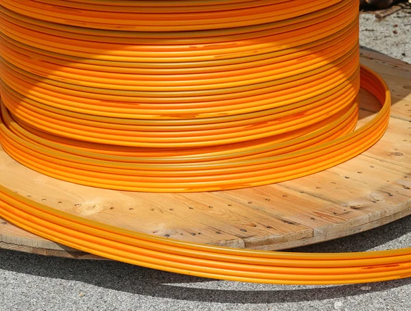 Orange pipes for fiber optic connection ADSL users — Stock Photo, Image