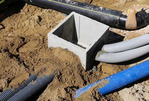 Corrugated pipes for electrical cables and a cockpit in concrete — Stock Image Corrugated pipes for electrical cables and a cockpit in concrete Royalty Free Stock Images