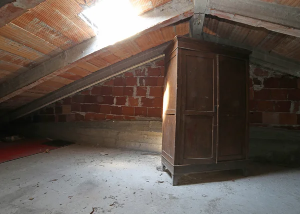 Wooden wardrobe in the dusty attic — Stock Photo, Image