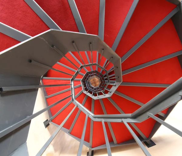 Spiral staircase with red carpet — Stock Photo, Image