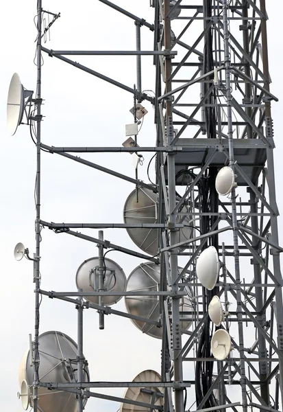 Telecommunications antennas and repeaters — Stock Photo, Image