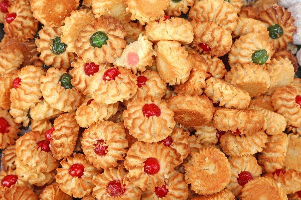 Γλυκά και μπισκότα αμυγδάλου με γλάσο και ζαχαρωμένα φρούτα για ΑΕ — Φωτογραφία Αρχείου