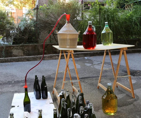 Bottling and decanting of wine from the Carboy bottles — Stock Photo, Image