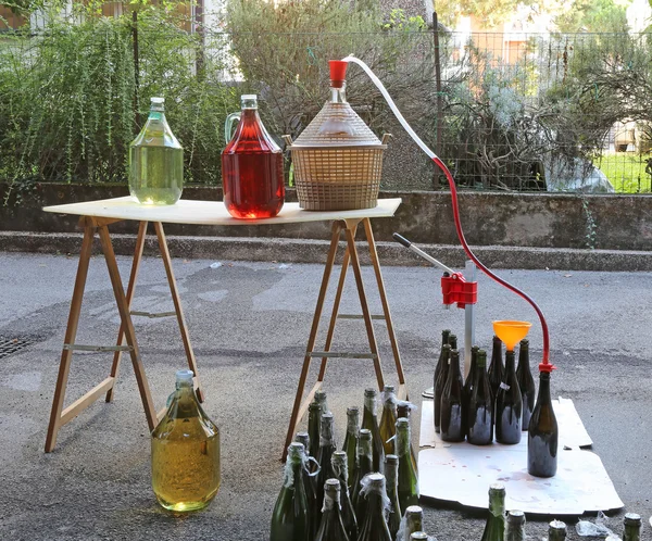 Bottling and decanting of wine from the Carboy bottles — Stock Photo, Image