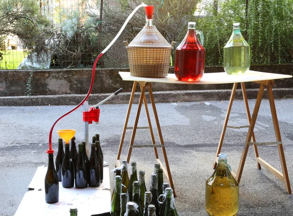 Bottling and decanting of wine from the Carboy bottles — Stock Photo, Image