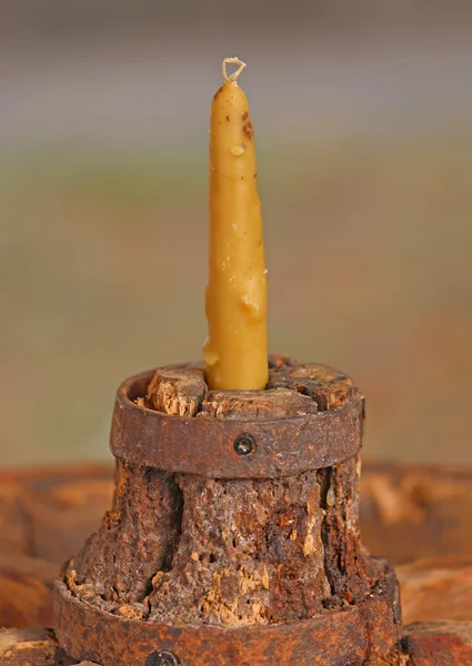 Old yellow candle made with the wax of bees — Stock Photo, Image