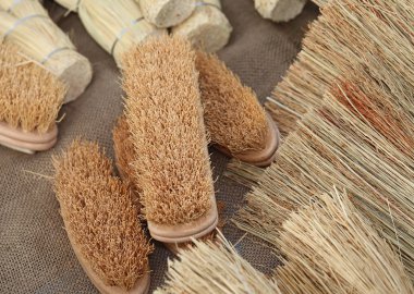 brooms and brushes of sorghum at the market