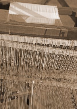 old textile loom for weaving of yarns of cotton and wool clipart